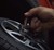 person changing car tire